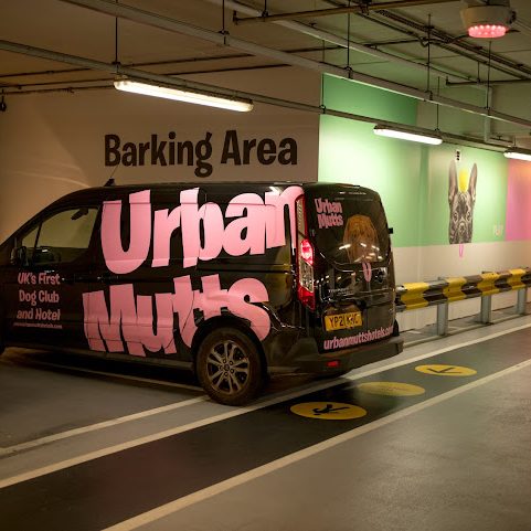 Urban Mutts Hotels bay parking area and company van